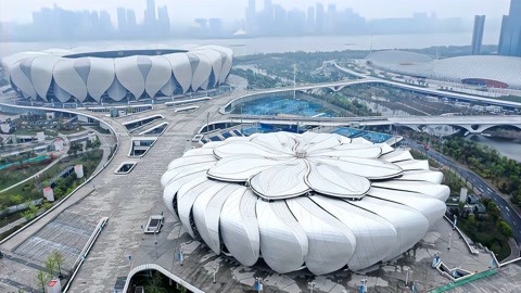 杭州亚运会56个竞赛场馆竣工 大莲花绽放钱塘江畔